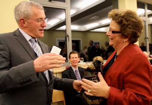 Dean John Dinnen makes a presentation to CITI staff member, Daphne Metcalfe, at the 50th anniversary celebrations